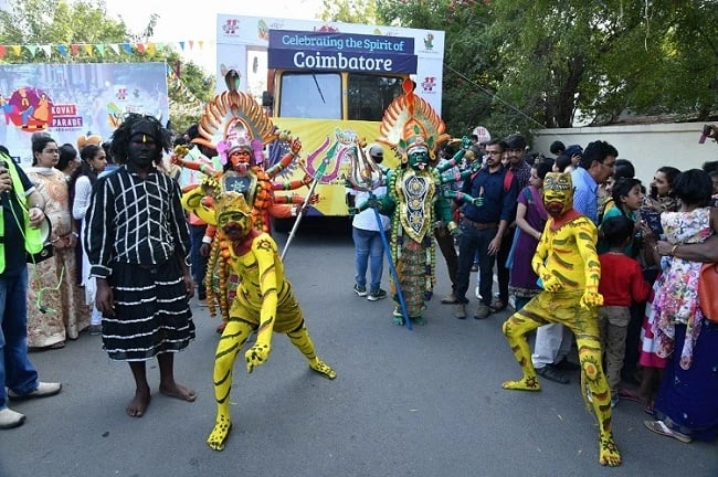 Performers in colourful costumes at the Grand Kovai Parade.