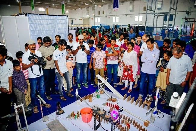 Visitors exploring student projects at the science exhibition.